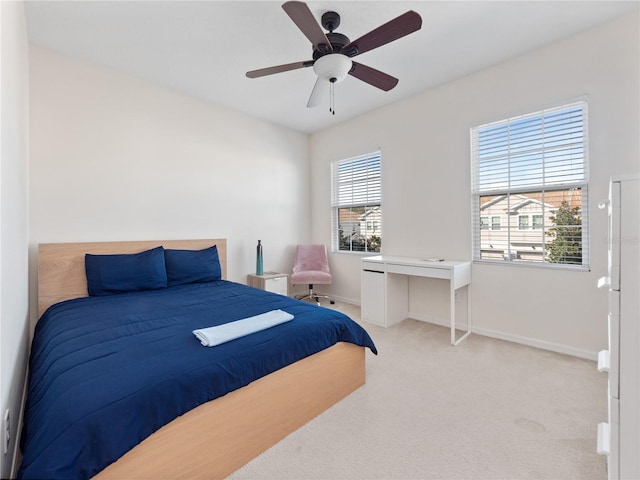 carpeted bedroom with ceiling fan