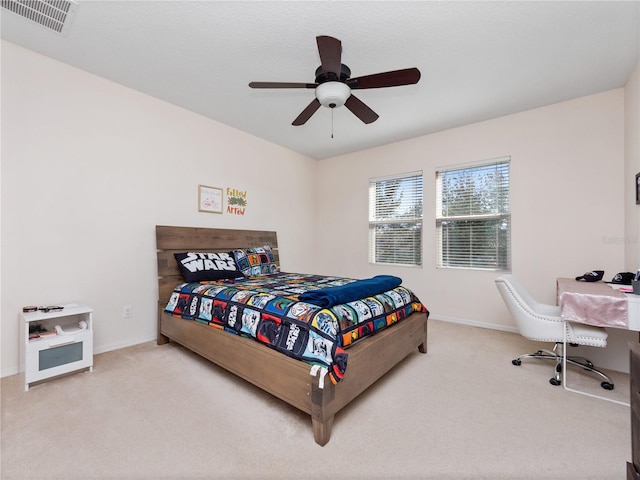 bedroom with ceiling fan and carpet