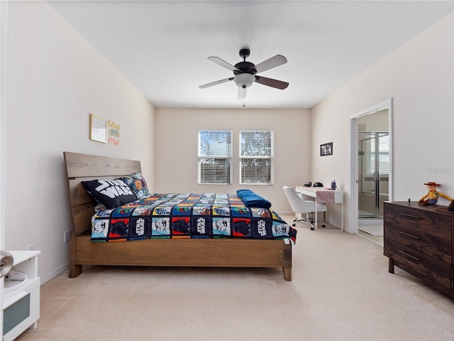 bedroom featuring light carpet and ceiling fan