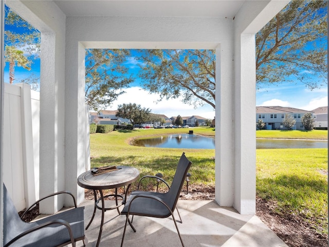 view of patio with a water view