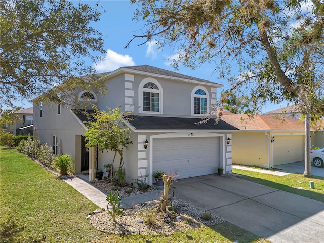 view of front of property featuring a garage and a front yard