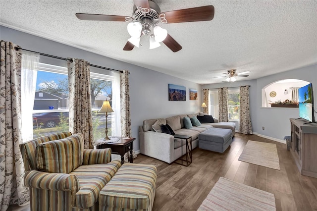 living room with hardwood / wood-style floors and a textured ceiling