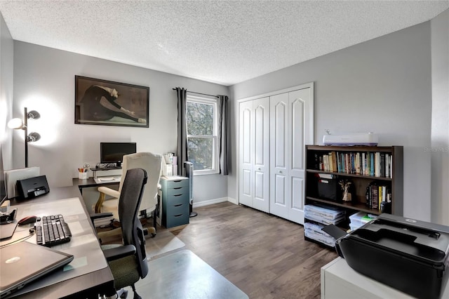 office space featuring hardwood / wood-style flooring and a textured ceiling