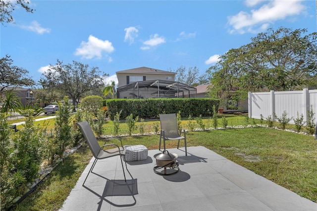 view of patio featuring a lanai