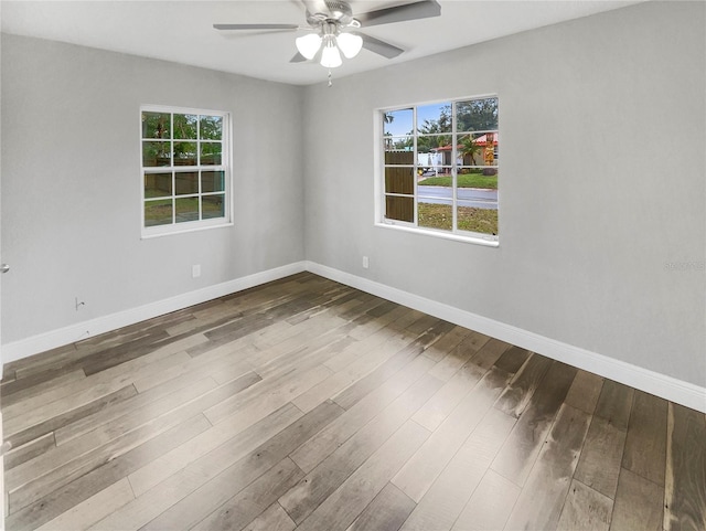 unfurnished room featuring hardwood / wood-style flooring and ceiling fan