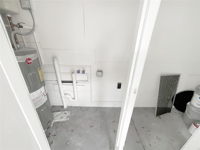 laundry room featuring electric water heater