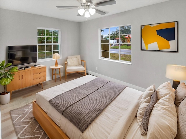 bedroom featuring ceiling fan and light wood-type flooring