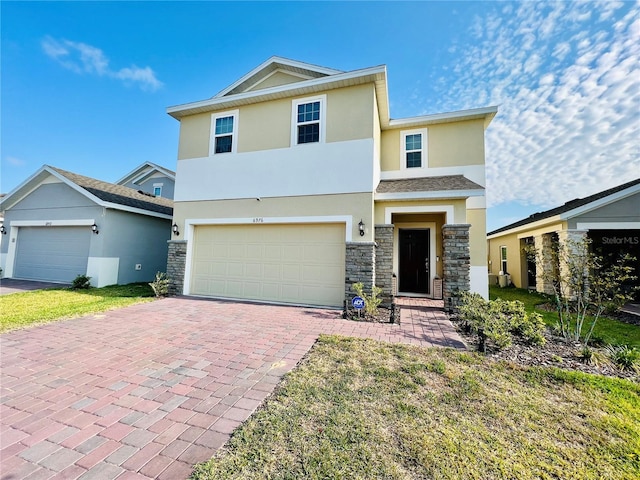 view of front of home featuring a garage and a front yard