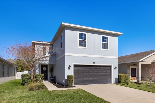 view of front property featuring a garage and a front yard