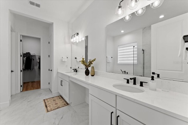 bathroom with vanity and walk in shower