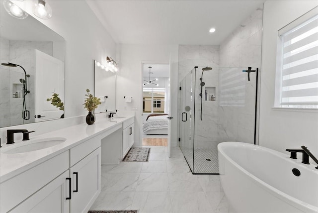 bathroom featuring vanity and shower with separate bathtub