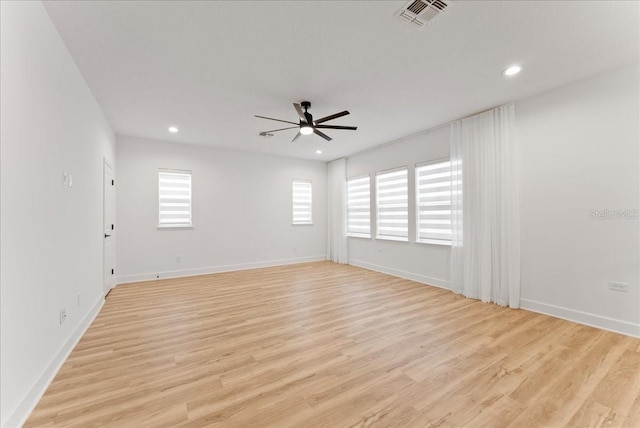 unfurnished room with light hardwood / wood-style flooring and ceiling fan