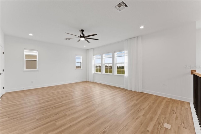 unfurnished living room featuring ceiling fan and light hardwood / wood-style flooring