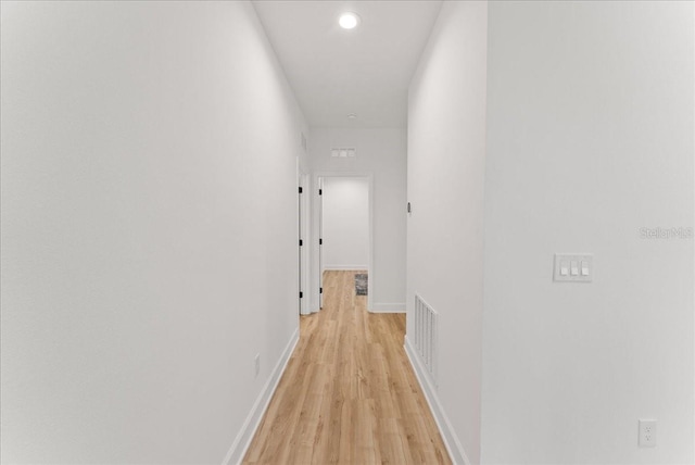 hallway featuring light hardwood / wood-style flooring