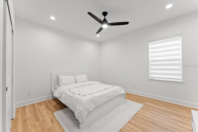 bedroom featuring ceiling fan and light hardwood / wood-style flooring