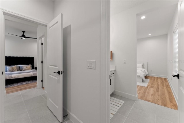 bathroom with vanity, ceiling fan, and tile patterned flooring