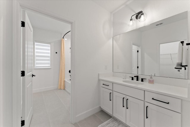 bathroom with tile patterned floors, vanity, and shower / bath combo