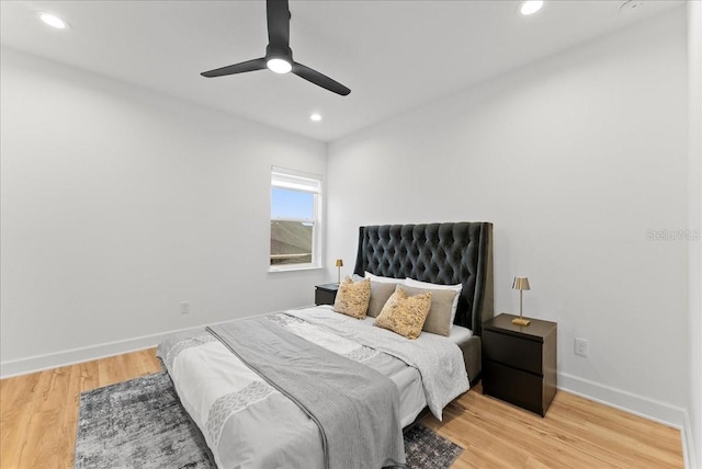 bedroom featuring ceiling fan and light hardwood / wood-style flooring