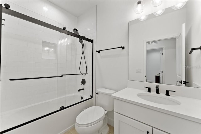 full bathroom featuring shower / bath combination with glass door, vanity, and toilet