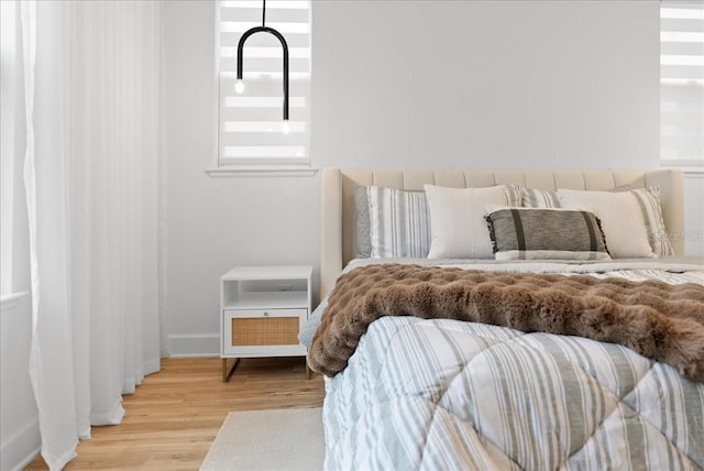 bedroom with light hardwood / wood-style flooring