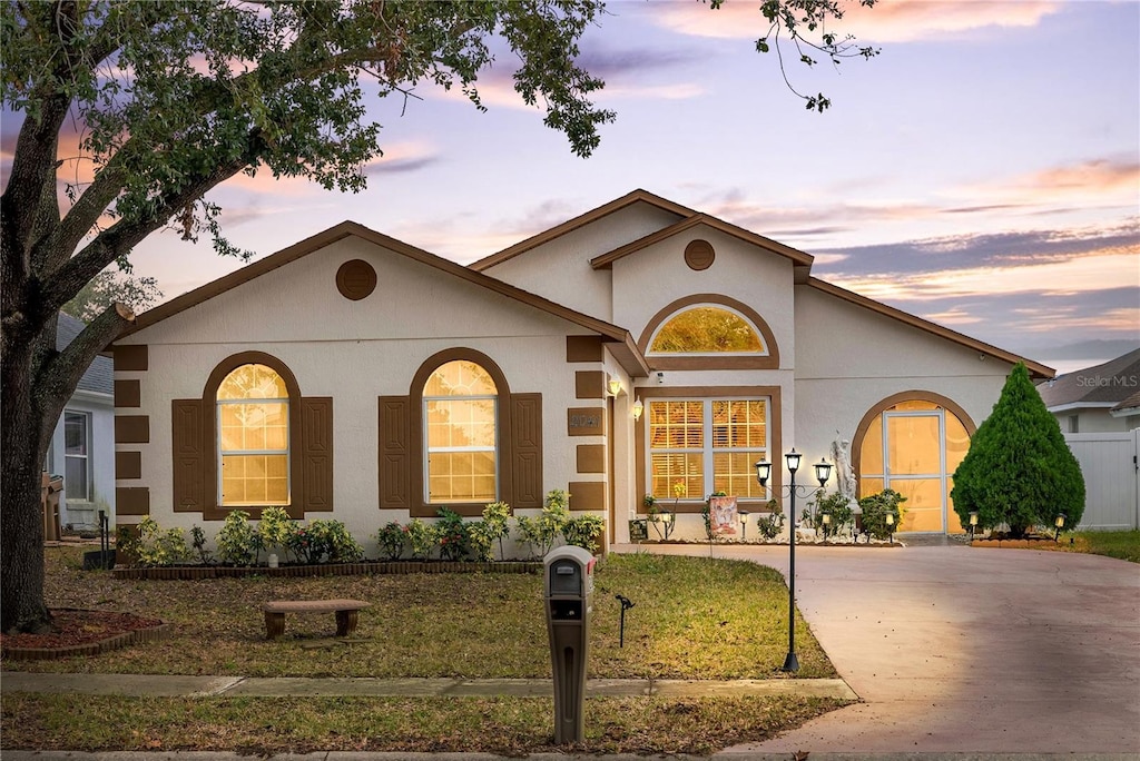 view of front of property with a lawn