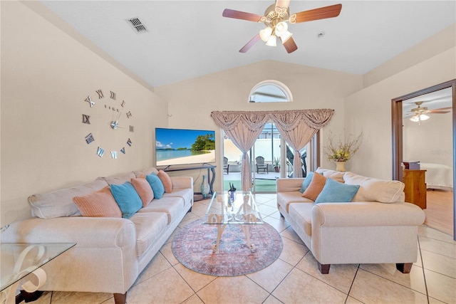 living room with light tile patterned flooring, ceiling fan, and vaulted ceiling