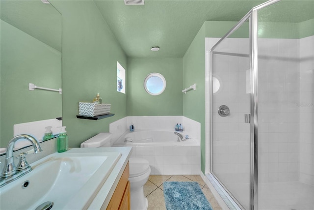 full bathroom with separate shower and tub, vanity, a textured ceiling, tile patterned floors, and toilet