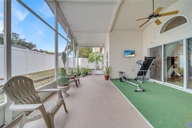 sunroom featuring ceiling fan