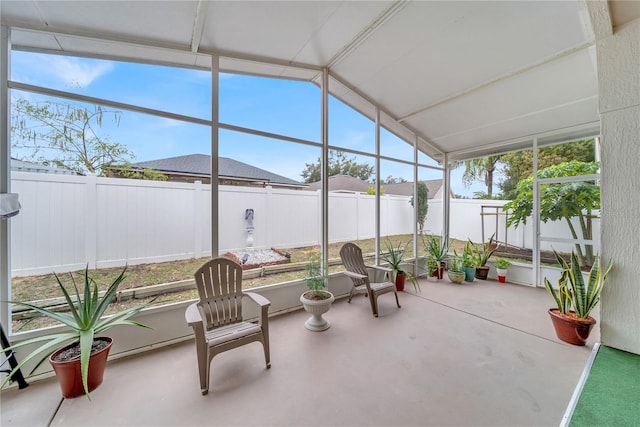 sunroom / solarium with vaulted ceiling