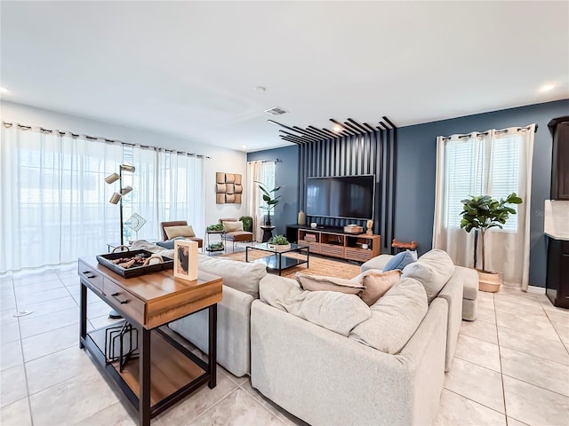 living room with plenty of natural light and light tile patterned flooring