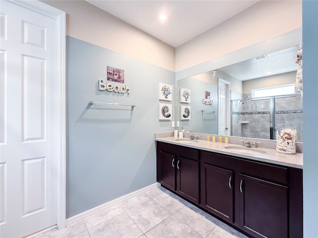 bathroom with vanity, walk in shower, and tile patterned flooring