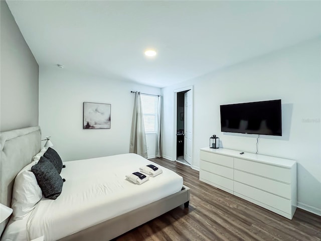 bedroom featuring dark hardwood / wood-style floors