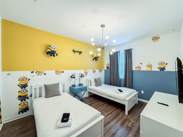 bedroom with a chandelier and dark hardwood / wood-style flooring