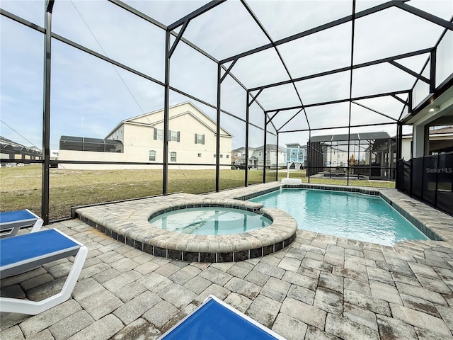 view of swimming pool with glass enclosure, an in ground hot tub, a yard, and a patio