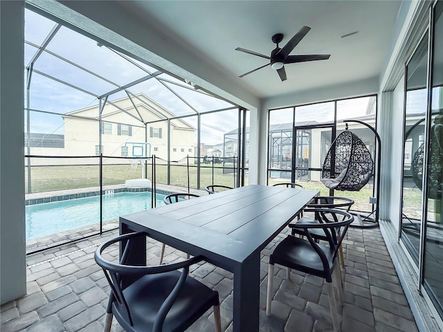 sunroom / solarium with ceiling fan