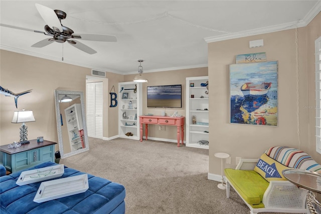 carpeted living room featuring ceiling fan and ornamental molding