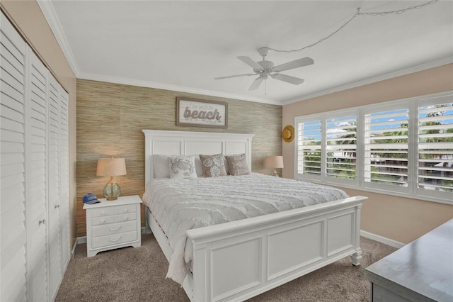 carpeted bedroom featuring a closet, ceiling fan, and ornamental molding