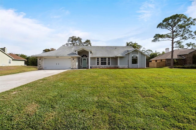 single story home featuring a garage and a front lawn