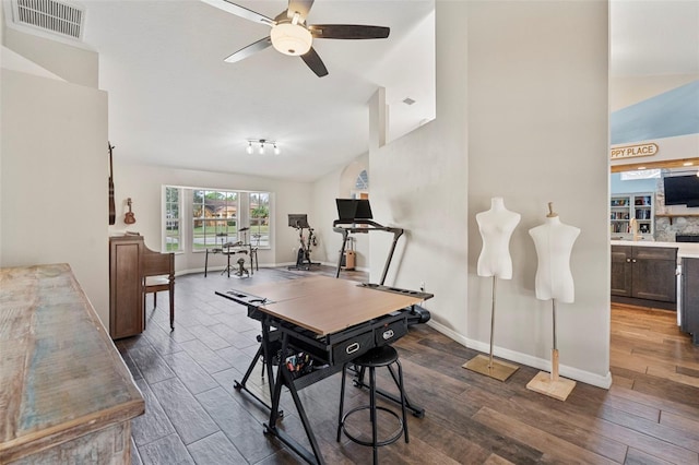 dining space featuring ceiling fan and lofted ceiling