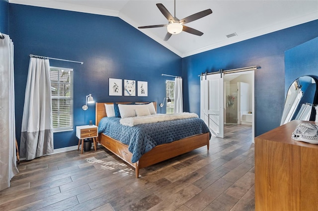 bedroom featuring ceiling fan, a barn door, dark wood-type flooring, and lofted ceiling