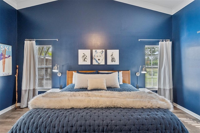 bedroom with hardwood / wood-style flooring and crown molding