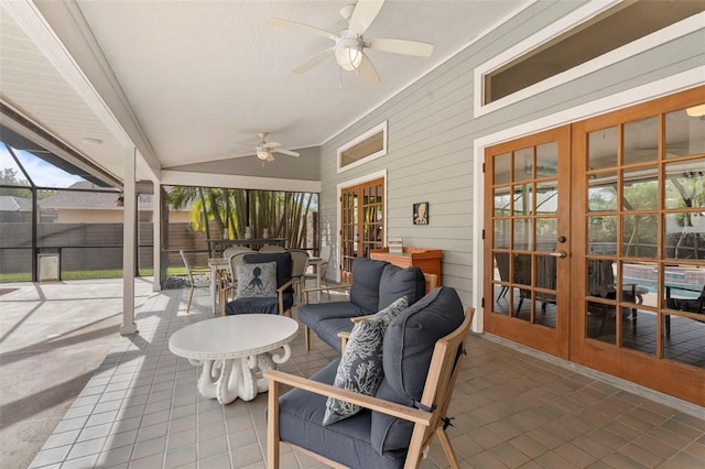 sunroom featuring ceiling fan, lofted ceiling, and french doors