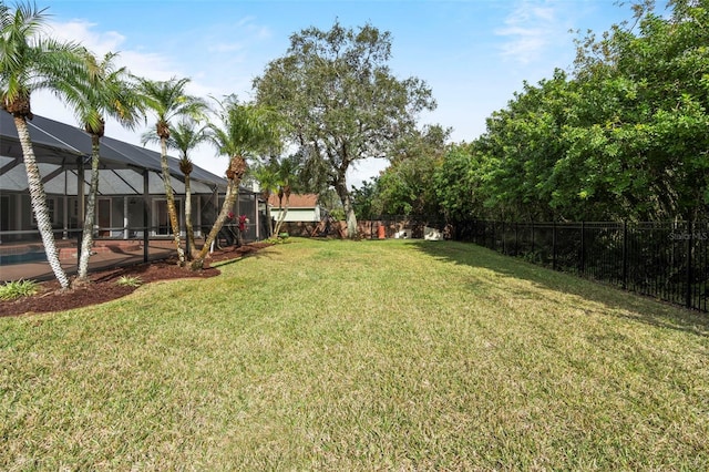 view of yard featuring a pool and a lanai