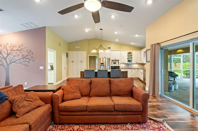 living room featuring vaulted ceiling, ceiling fan, and dark hardwood / wood-style floors