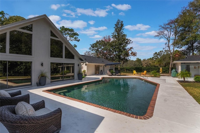 view of swimming pool featuring a patio