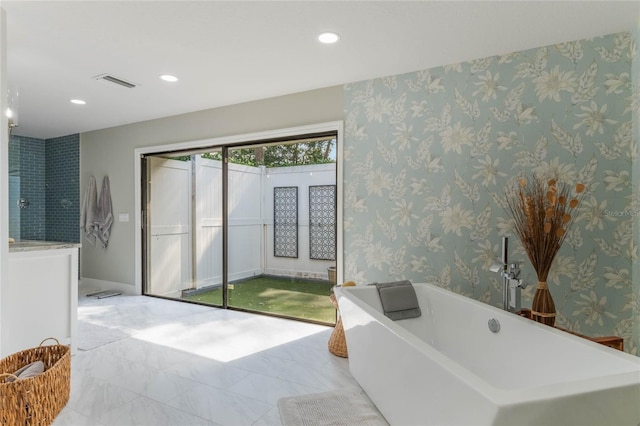 bathroom featuring a tub to relax in