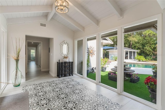 interior space with plenty of natural light, lofted ceiling with beams, and wooden ceiling