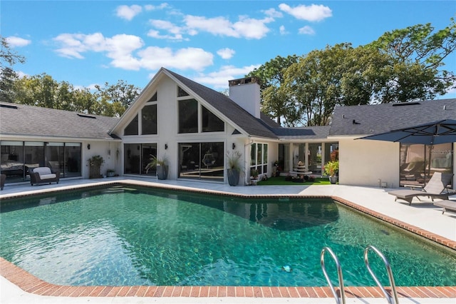 view of swimming pool with a patio area