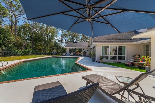 view of swimming pool featuring a patio