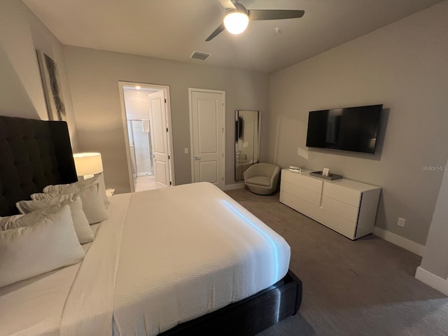 bedroom with ceiling fan, carpet, and ensuite bath